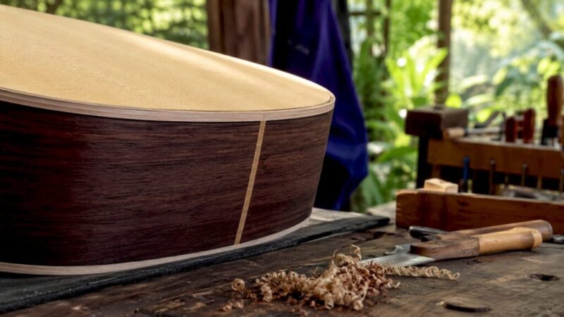 Close-up of guitar binding on acoustic guitar edge