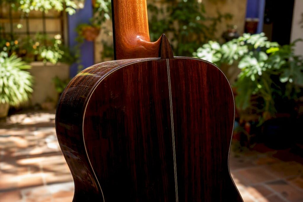 Dark rosewood flamenco guitar back close-up