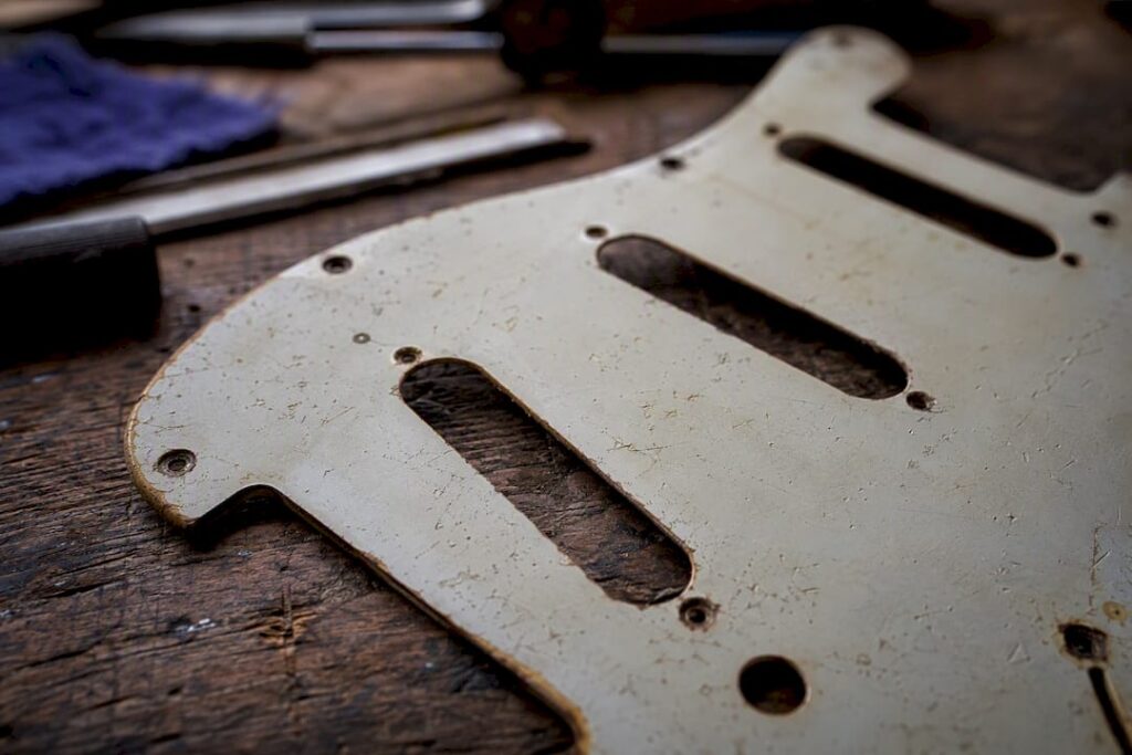 Close-up of pickguard finish and screw patina