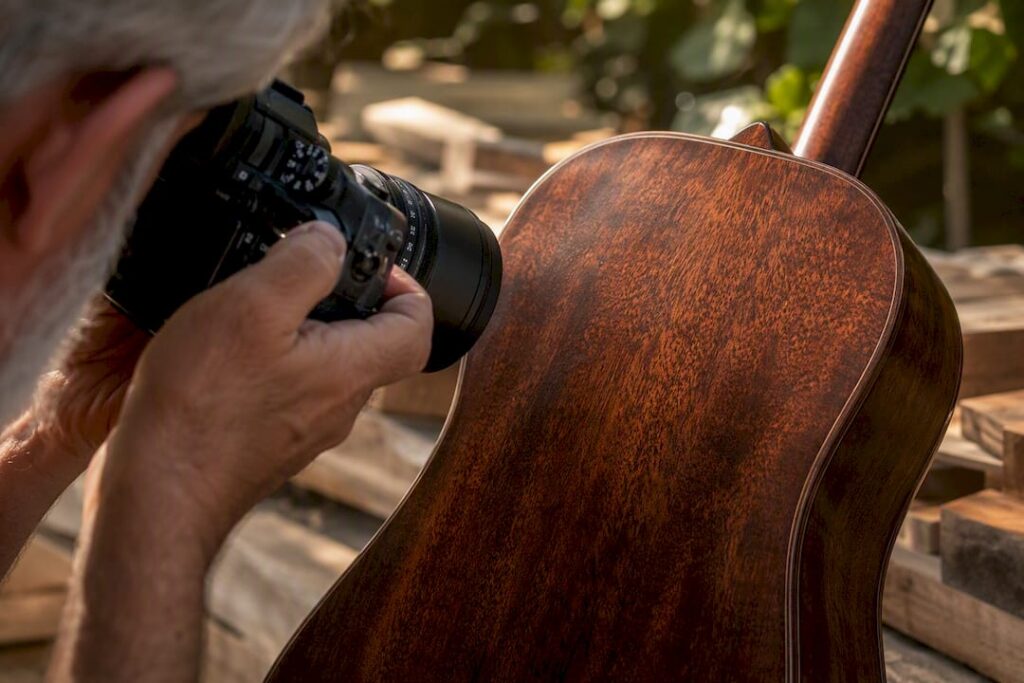 Hands photographing palisander wood grain detail