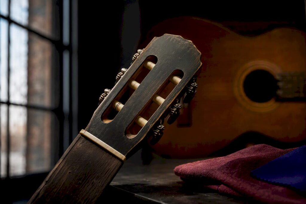 Cropped vintage guitar headstock under inspection