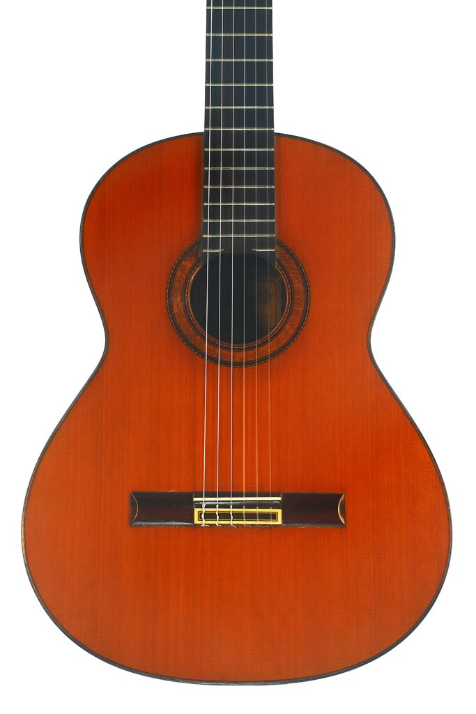 Die Ramirez 1a 1985 Klassische Gitarre mit Holzkorpus, dunklem Griffbrett, Nylonsaiten und rundem Schallloch ist vor einem weißen Hintergrund abgebildet. Die Ramirez 1a 1985 Klassische Gitarre mit Holzkorpus, dunklem Griffbrett, Nylonsaiten und rundem Schallloch ist vor einem weißen Hintergrund abgebildet.